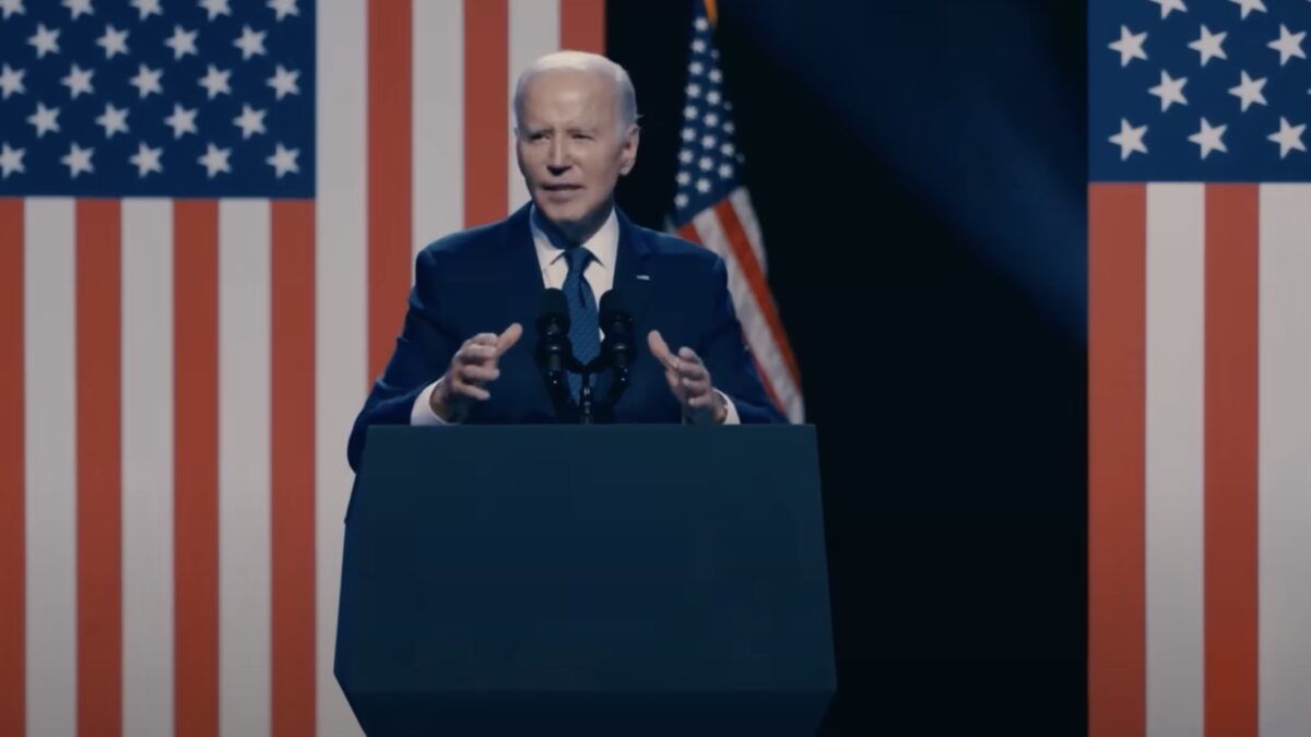Joe Biden speaking at a podium in his 2024 presidential campaign video.